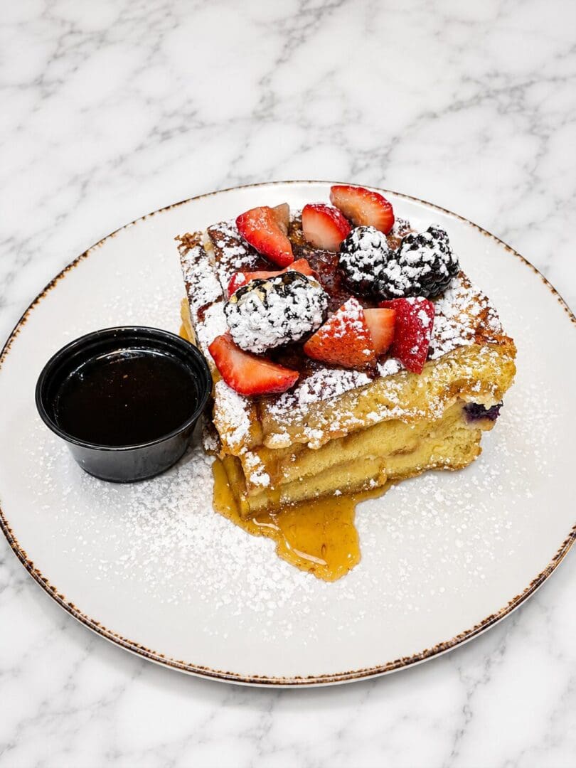 Berry-topped stuffed French toast with syrup