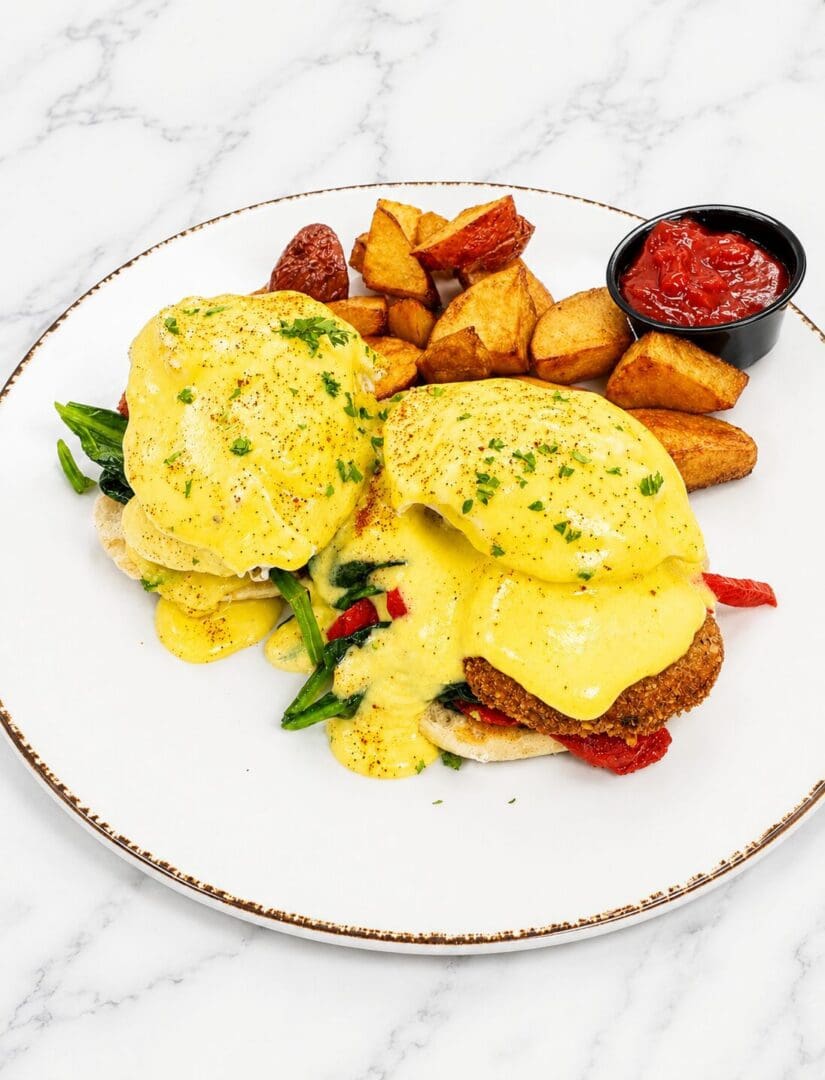 Eggs Benedict with roasted potatoes and hollandaise