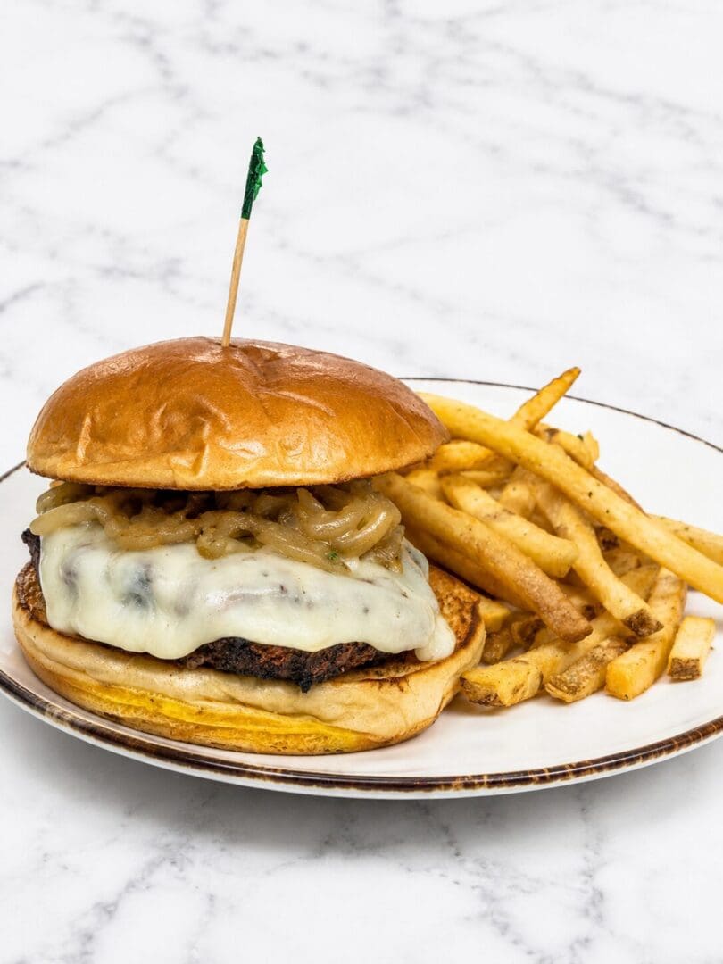 Cheeseburger with caramelized onions and fries