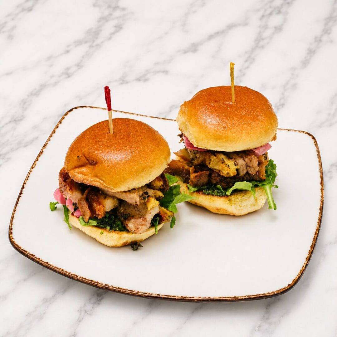 Two slider sandwiches on white plate