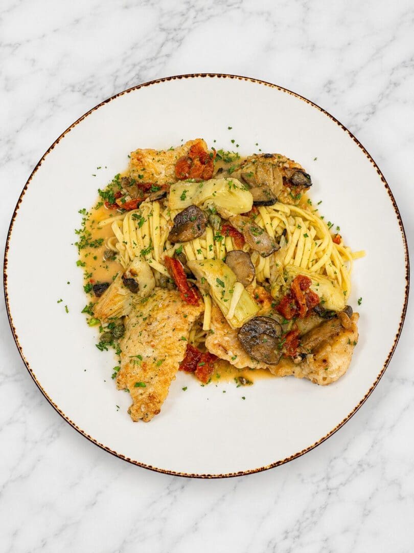 Pasta with chicken, mushrooms, and artichokes